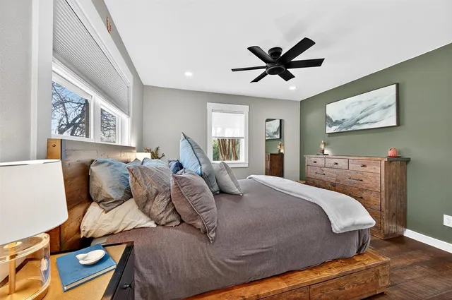 a bedroom with a bed and window