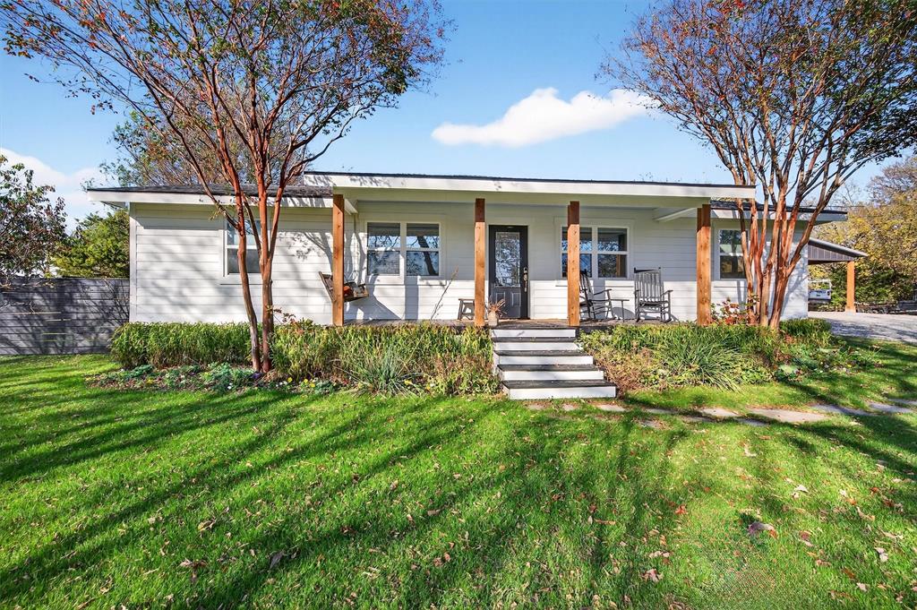 5816 Luella Road Sherman, TX 75090 - Photo 3 of 36 a front view of a house with garden