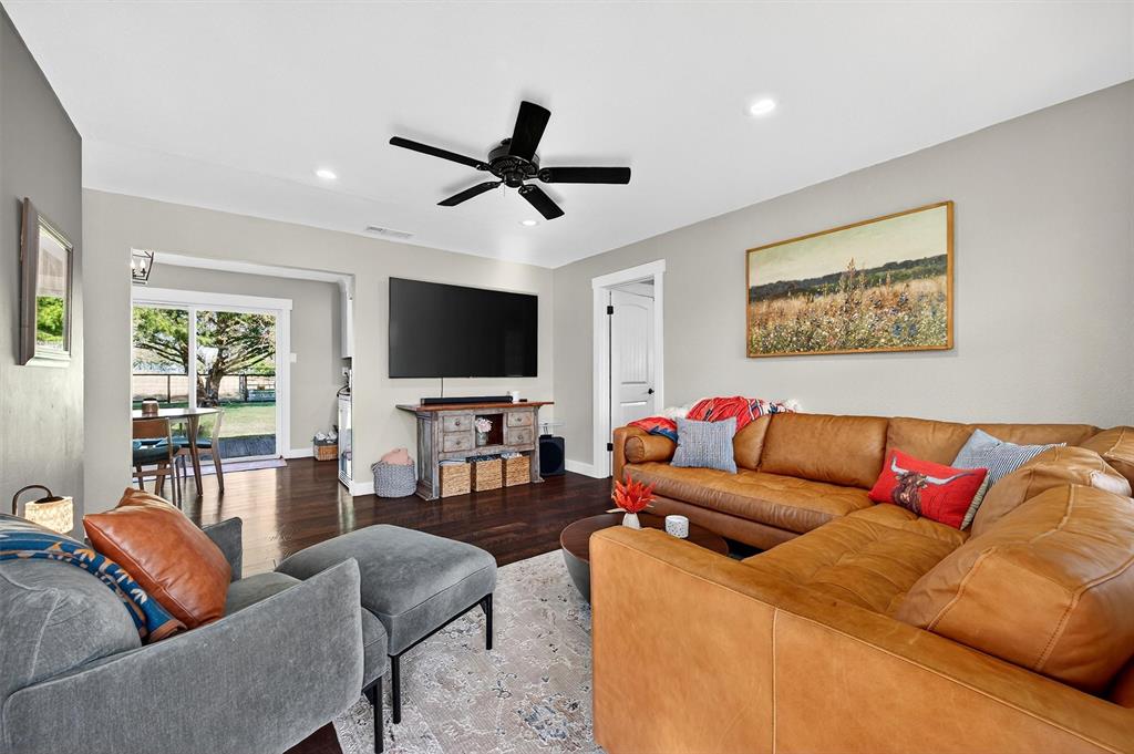 5816 Luella Road Sherman, TX 75090 - Photo 7 of 36 a living room with furniture and a flat screen tv