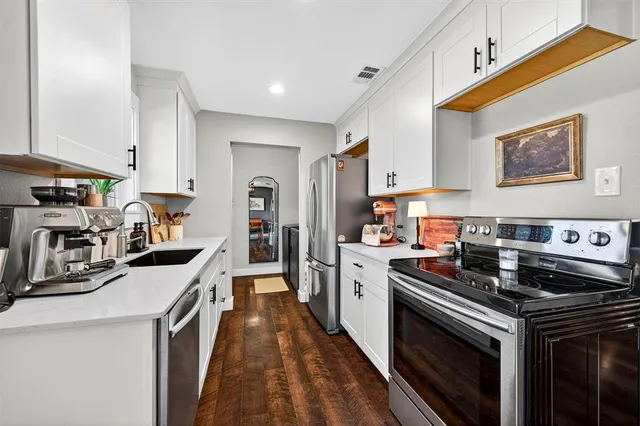 a kitchen with a stove and a sink