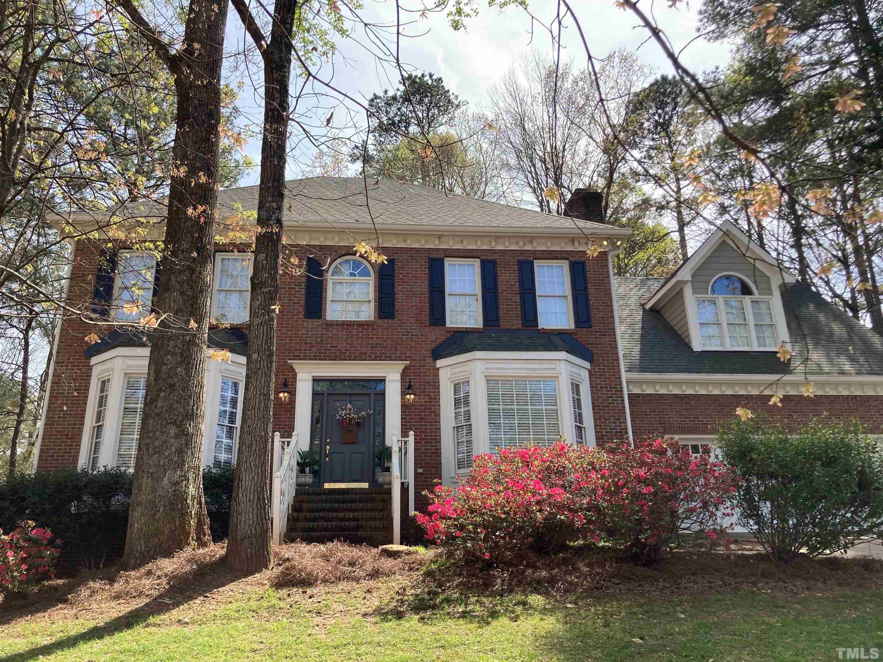 7608 Tylerton Drive Raleigh, NC 27613 - Photo 2 of 48 front view of a house with a yard