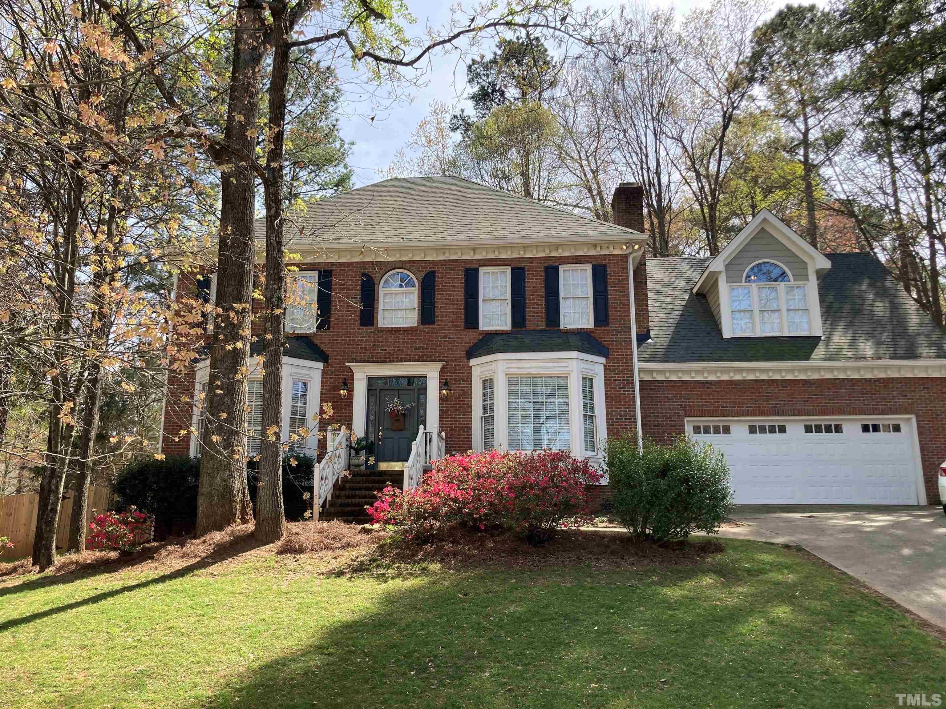 7608 Tylerton Drive Raleigh, NC 27613 - Photo 3 of 48 front view of a house with a yard
