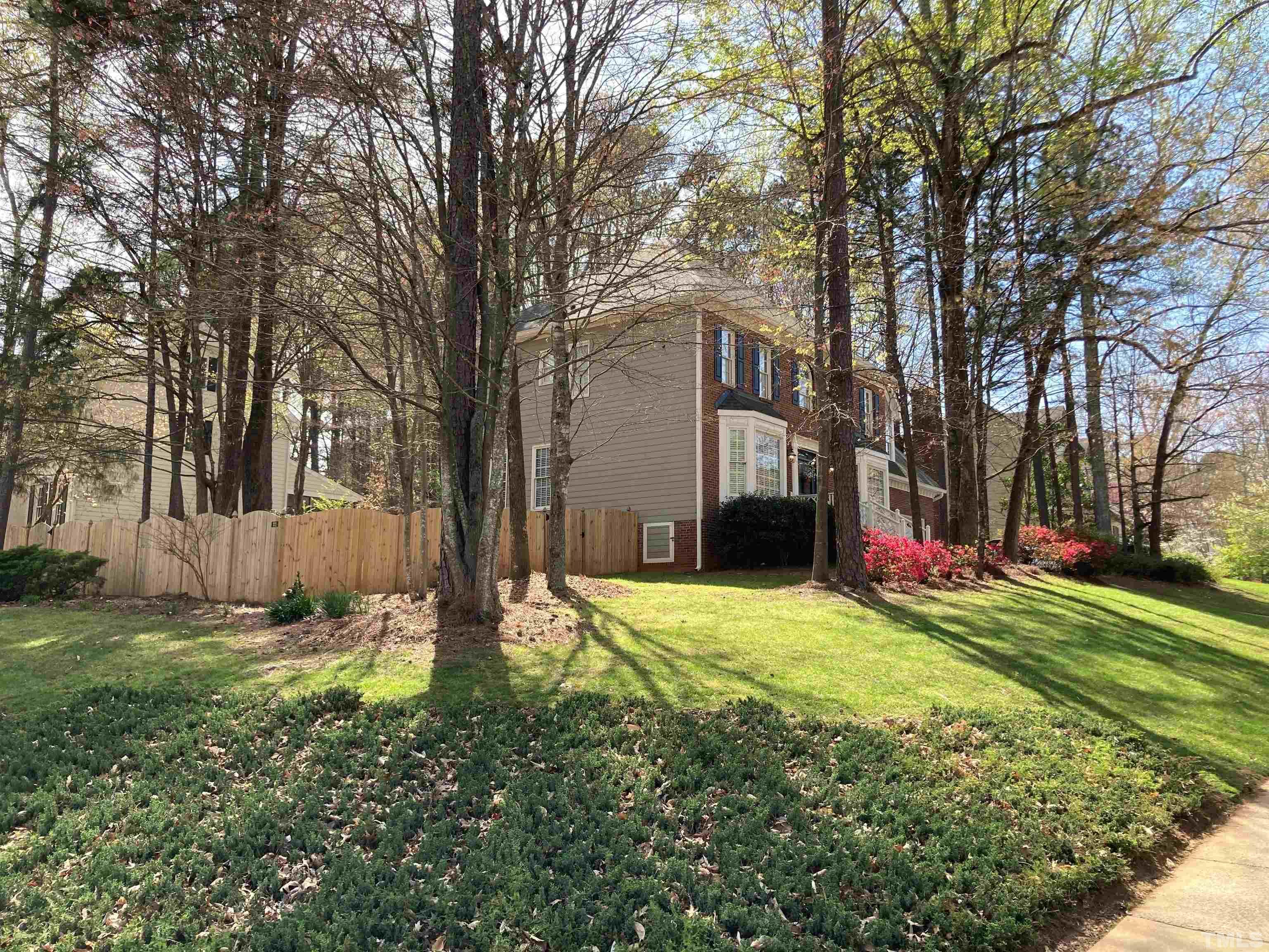 7608 Tylerton Drive Raleigh, NC 27613 - Photo 5 of 48 a view of a house with a yard and tree s
