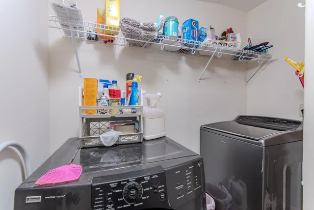 a room with a sink and wooden floor