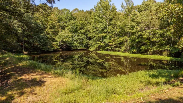 a view of a lake with a yard