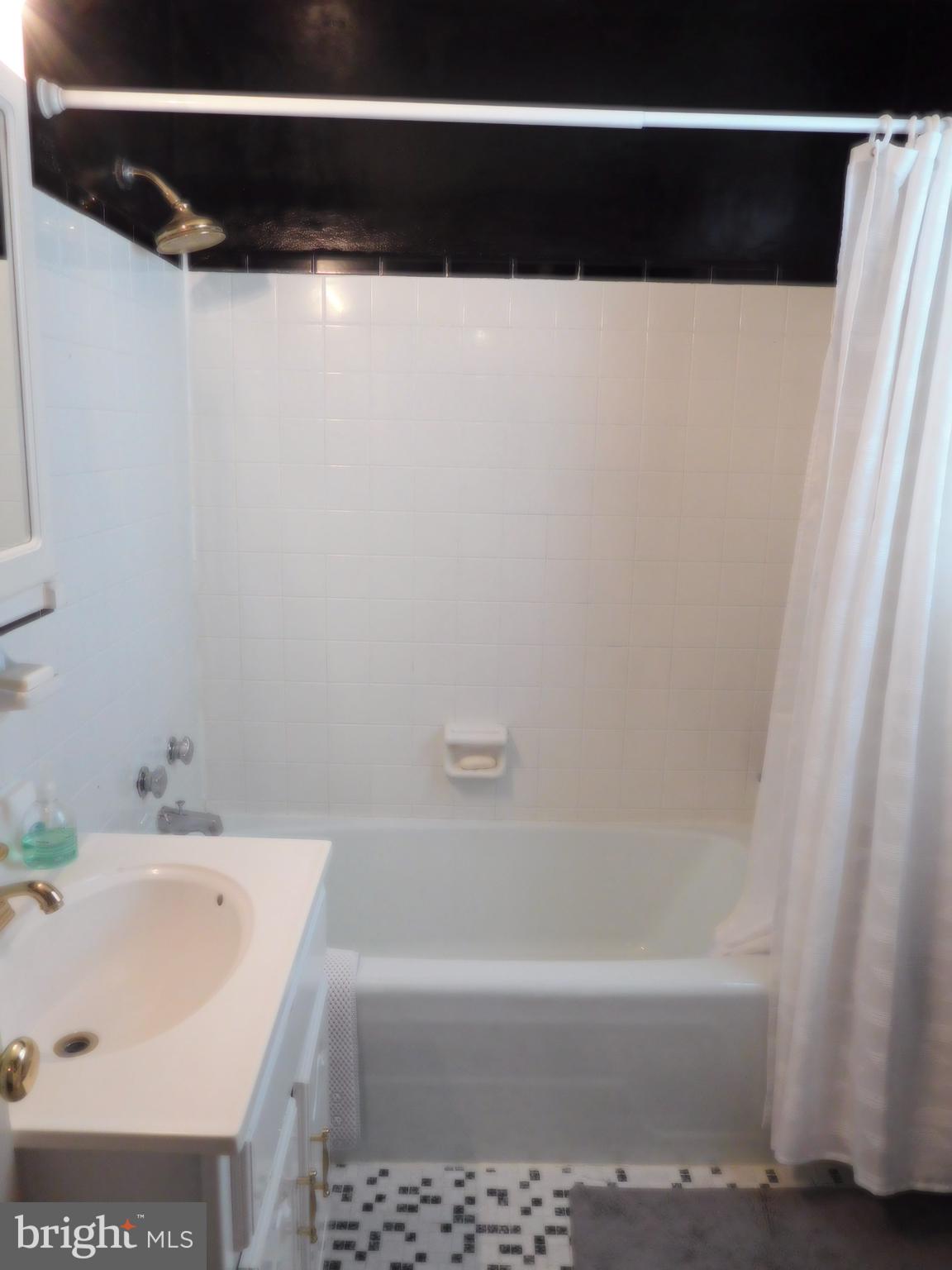 5 Hurst Road Wilmington, DE 19803 - Photo 24 of 37 Vintage tile w/rain shower nozzle and deep tub