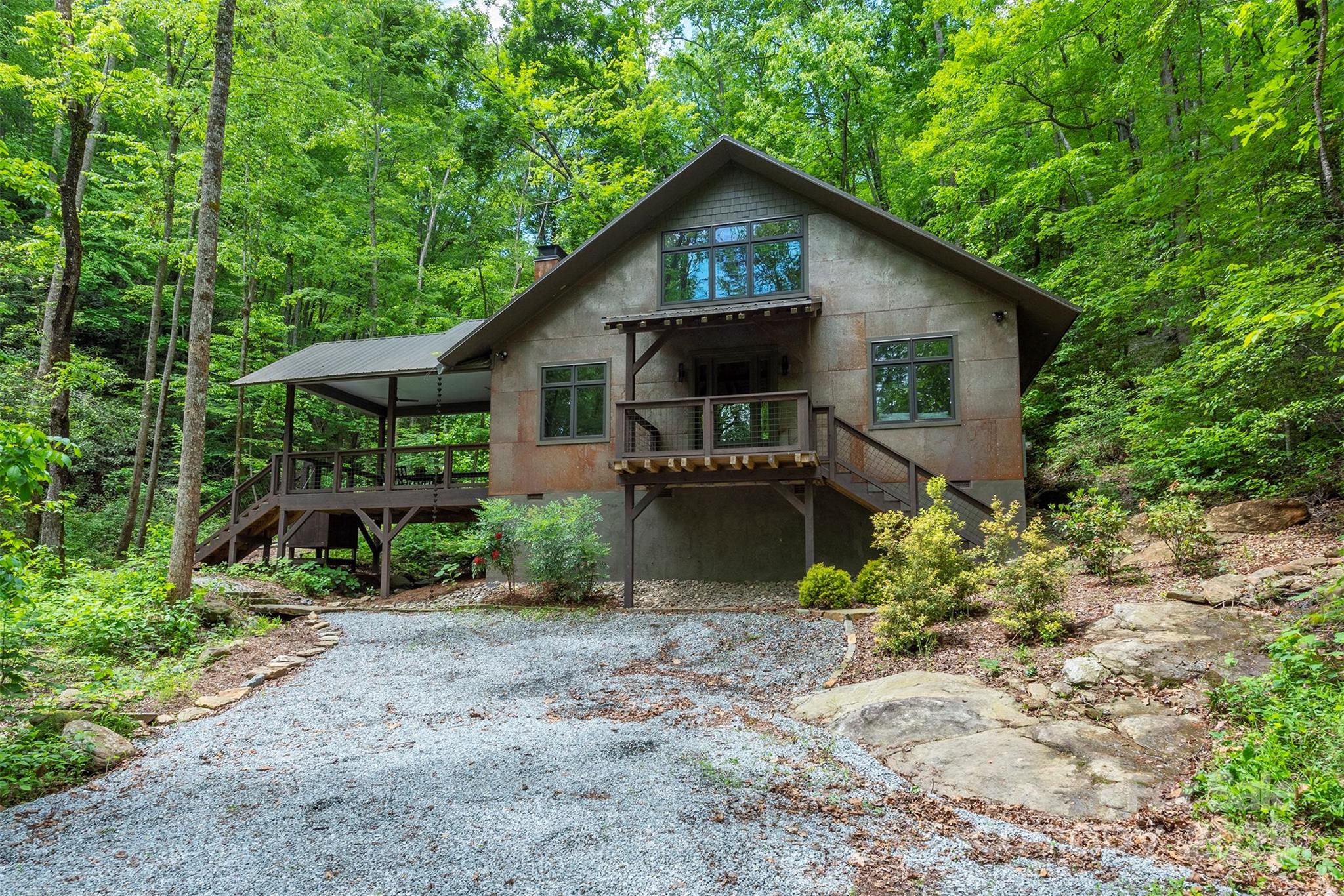 401 Winterle Road Black Mountain, NC 28711 - Photo 1 of 44 a front view of a house with garden