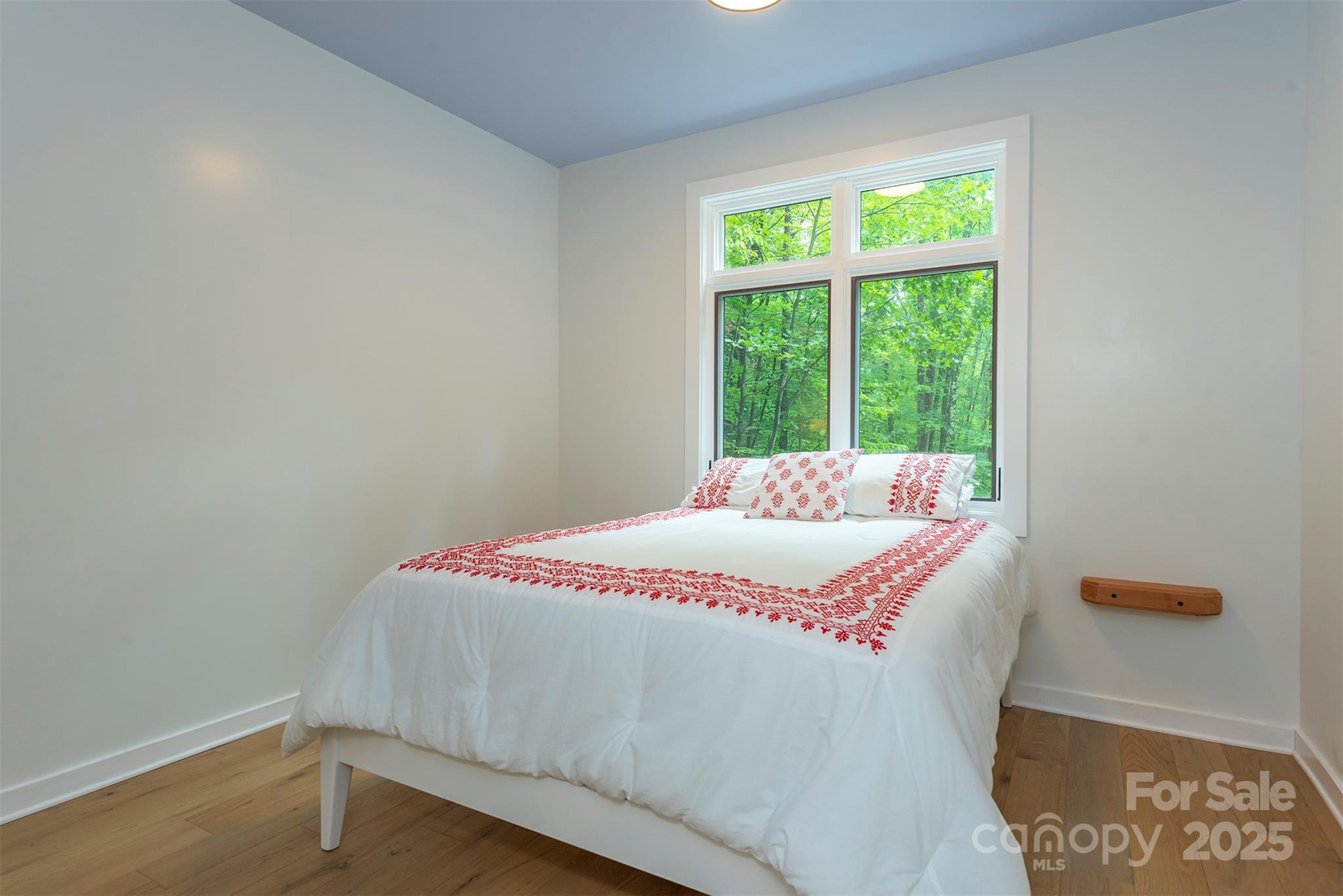 401 Winterle Road Black Mountain, NC 28711 - Photo 13 of 44 a bedroom with a bed and a window