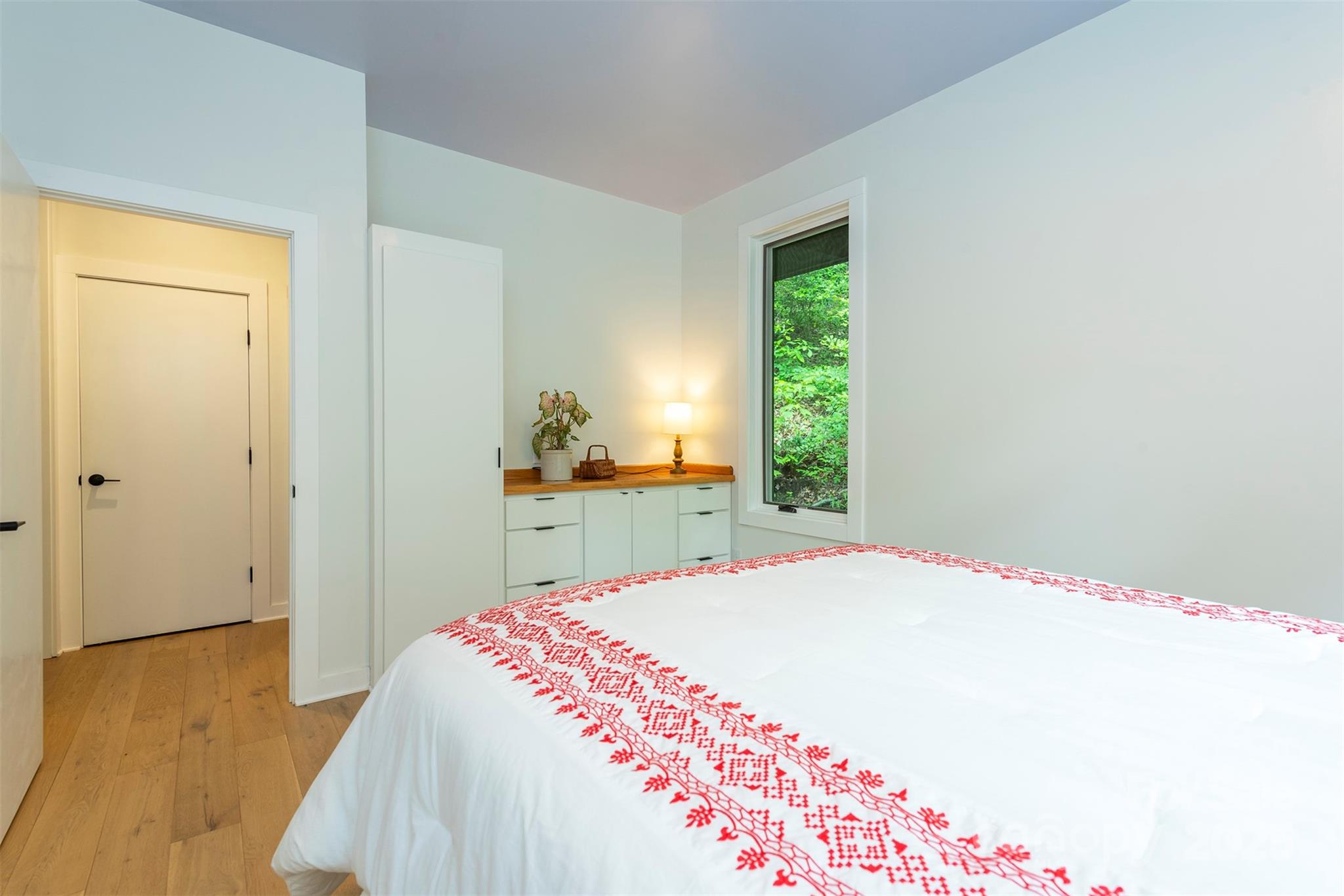 401 Winterle Road Black Mountain, NC 28711 - Photo 14 of 44 a bedroom with a bed and a window