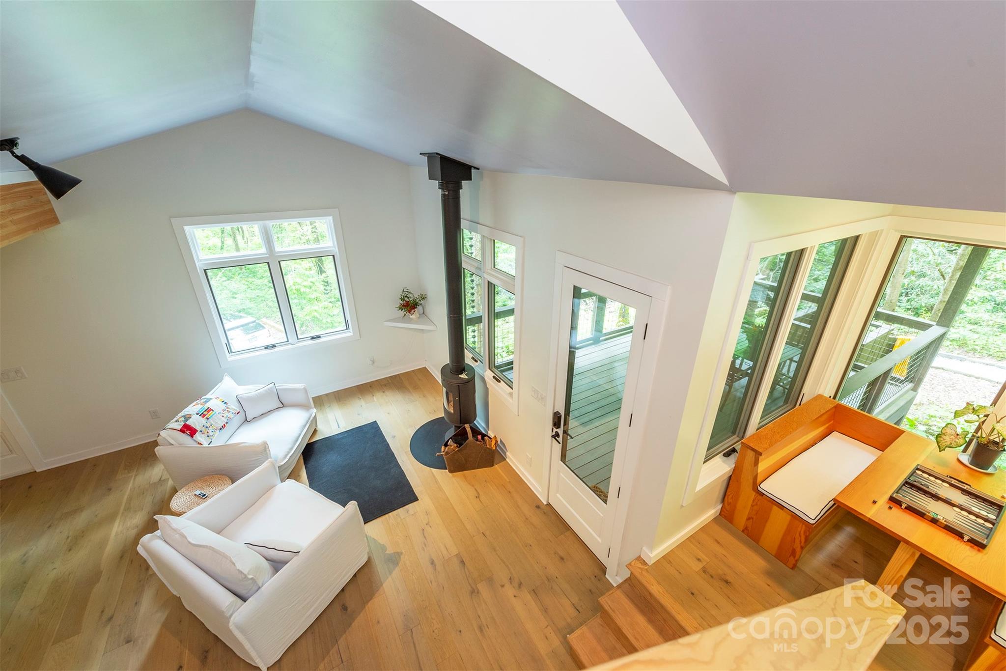 401 Winterle Road Black Mountain, NC 28711 - Photo 24 of 44 a living room with furniture and a floor to ceiling window