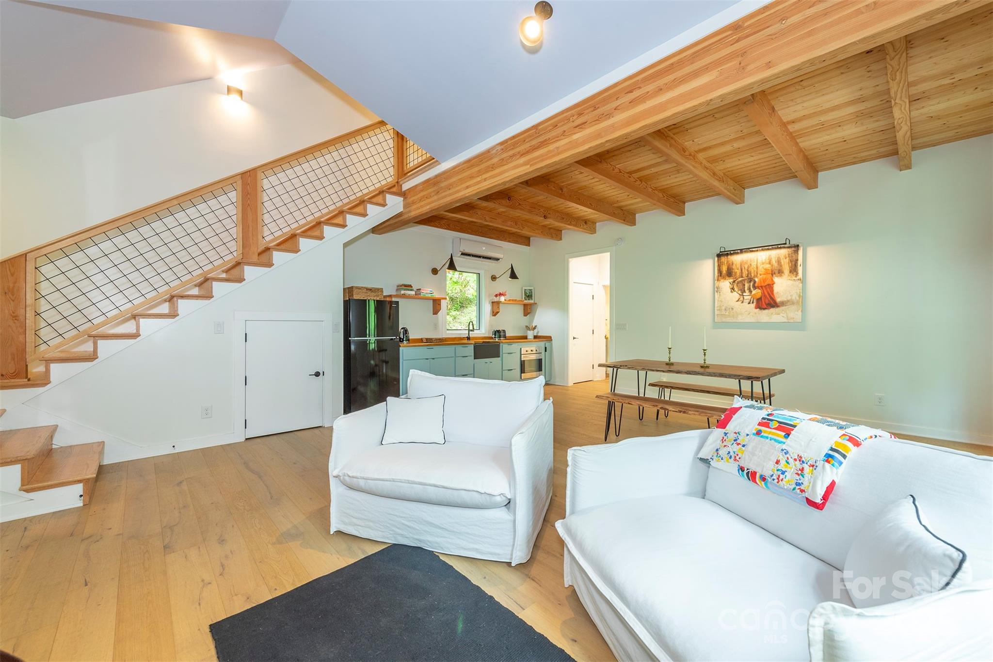 401 Winterle Road Black Mountain, NC 28711 - Photo 9 of 44 a living room with furniture and stairs