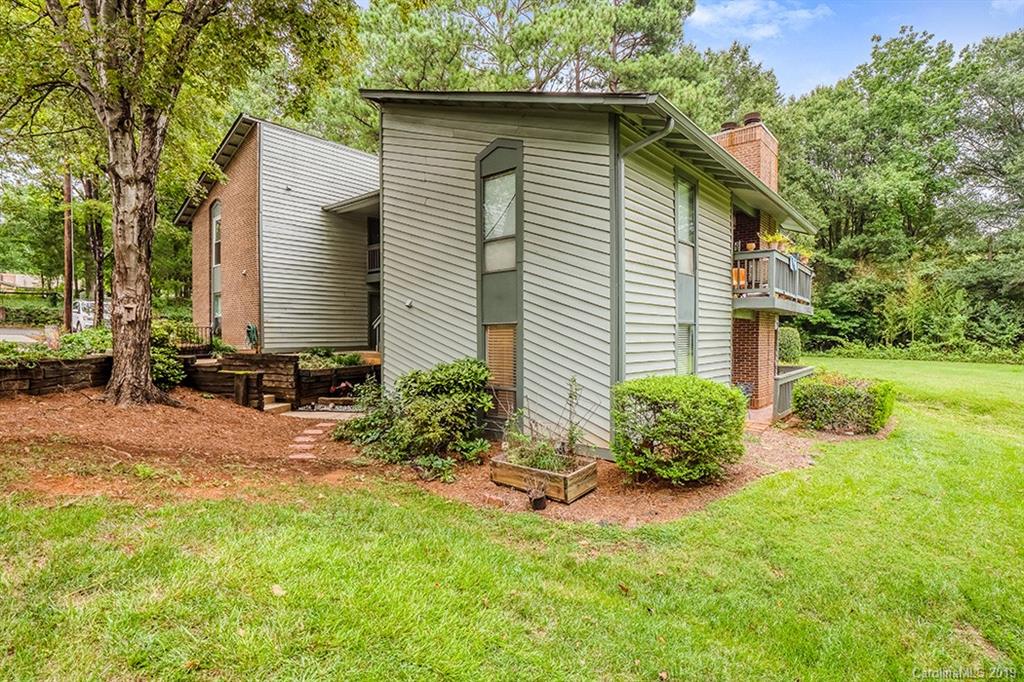 4948 Sardis Road, Unit B Charlotte, NC 28270 - Photo 1 of 30 a front view of a house with garden