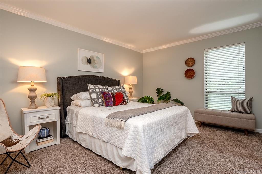 4948 Sardis Road, Unit B Charlotte, NC 28270 - Photo 14 of 30 a bedroom with a bed and a couch