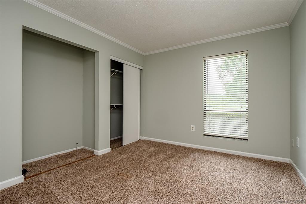 4948 Sardis Road, Unit B Charlotte, NC 28270 - Photo 17 of 30 a view of an empty room with a window