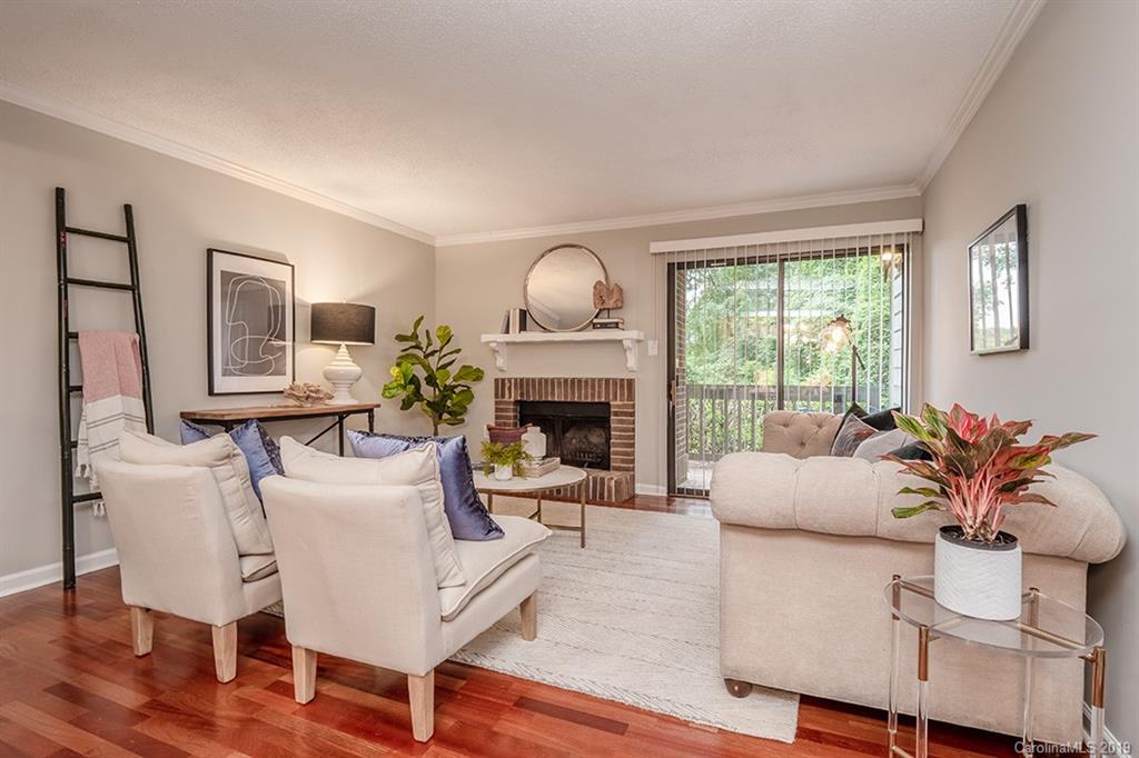 4948 Sardis Road, Unit B Charlotte, NC 28270 - Photo 3 of 30 a living room with furniture and a fireplace