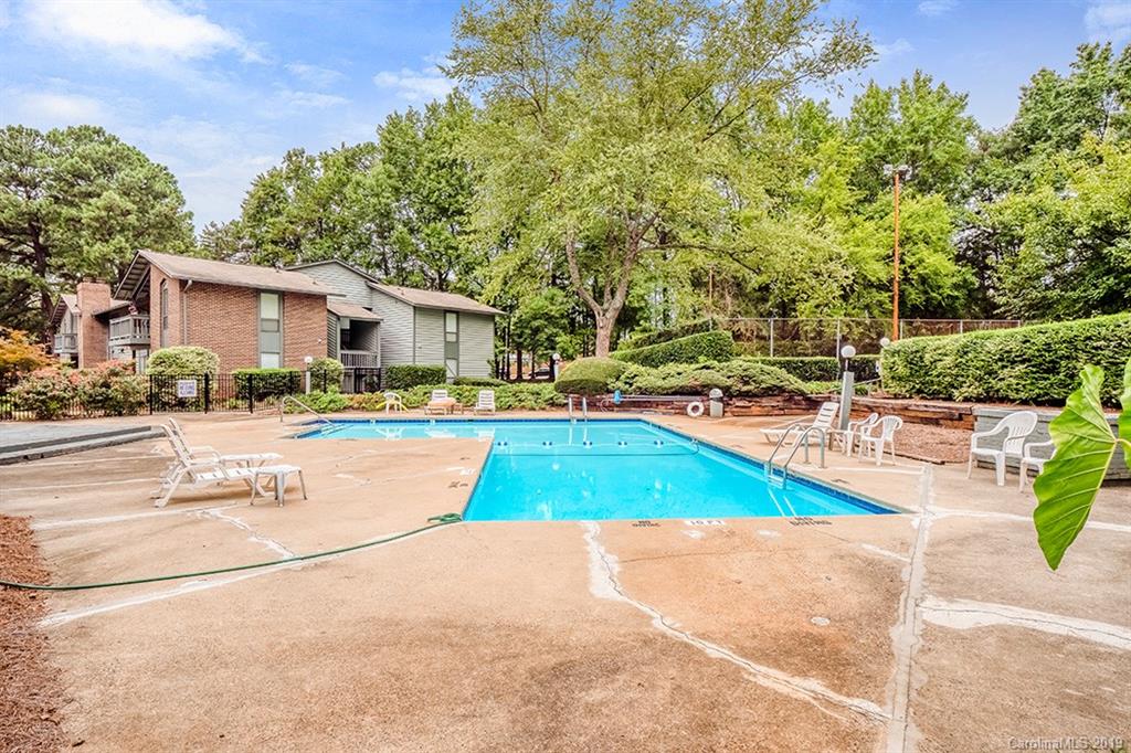 4948 Sardis Road, Unit B Charlotte, NC 28270 - Photo 23 of 30 a view of backyard with swimming pool and seating space