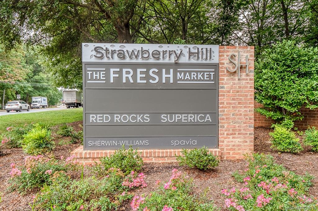 4948 Sardis Road, Unit B Charlotte, NC 28270 - Photo 26 of 30 a sign broad in front of flowers