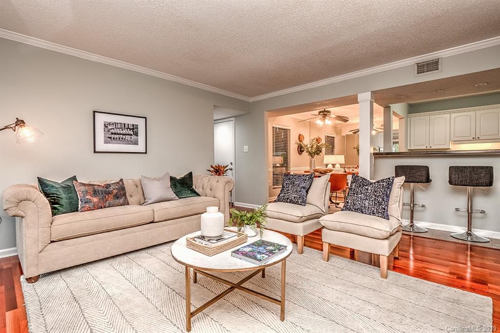 4948 Sardis Road, Unit B Charlotte, NC 28270 - Photo 5 of 30 a living room with furniture and a large window