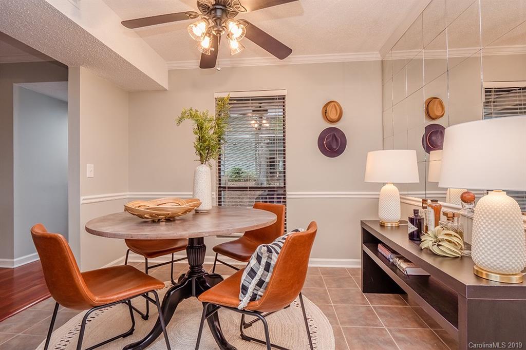 4948 Sardis Road, Unit B Charlotte, NC 28270 - Photo 8 of 30 a view of a dining room with furniture and chandelier