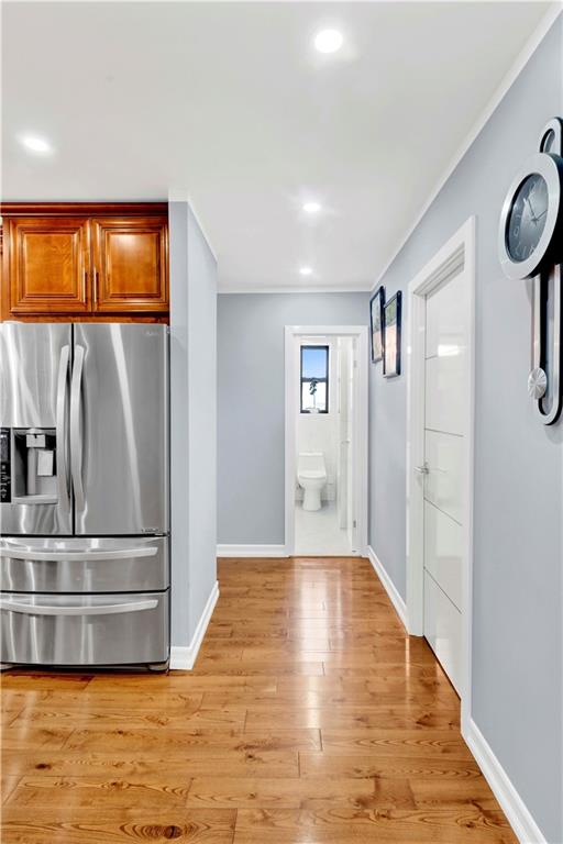 2241 Plumb 1st Street, Unit 5M Brooklyn, NY 11229 - Photo 17 of 24 a view of a kitchen with wooden floor and a window