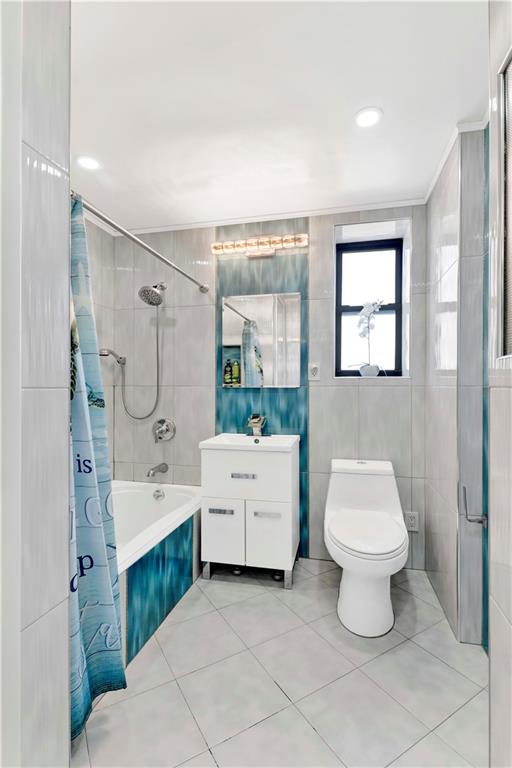 2241 Plumb 1st Street, Unit 5M Brooklyn, NY 11229 - Photo 19 of 24 a bathroom with a double vanity sink toilet and shower