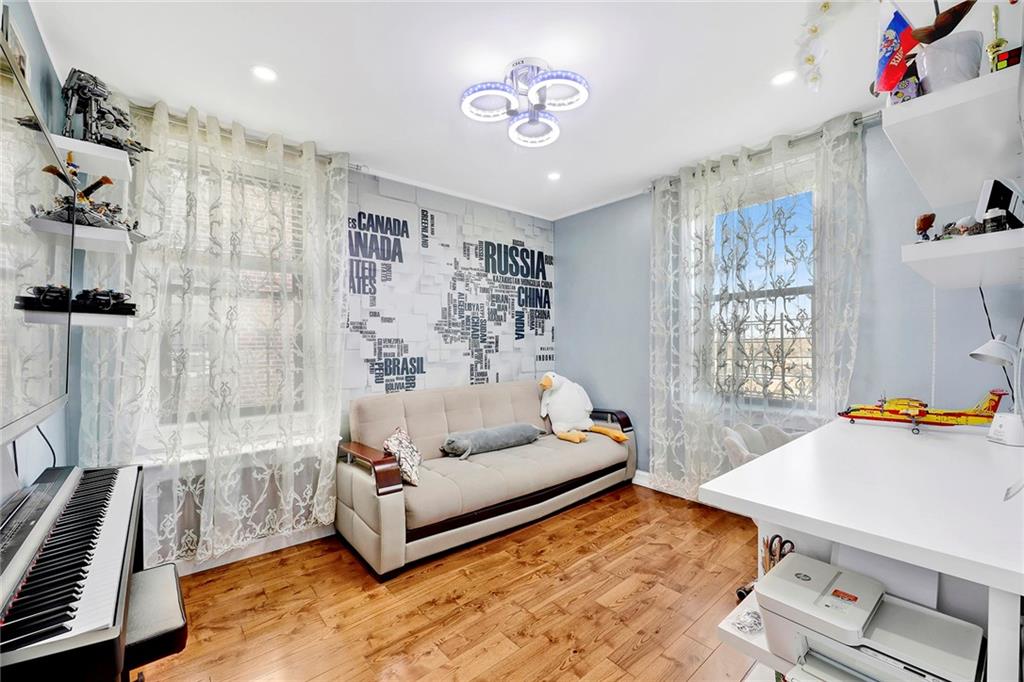 2241 Plumb 1st Street, Unit 5M Brooklyn, NY 11229 - Photo 22 of 24 a living room with furniture and a table