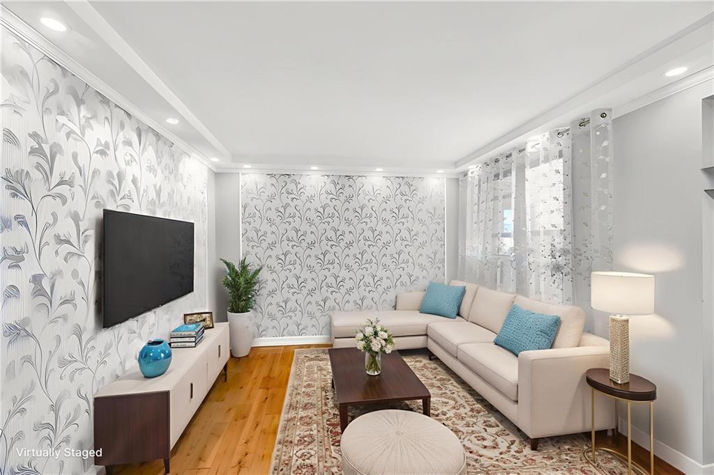 2241 Plumb 1st Street, Unit 5M Brooklyn, NY 11229 - Photo 6 of 24 a living room with furniture and a flat screen tv