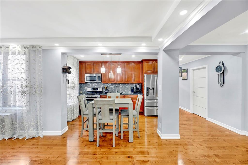 2241 Plumb 1st Street, Unit 5M Brooklyn, NY 11229 - Photo 10 of 24 a view of a dining room with furniture and wooden floor