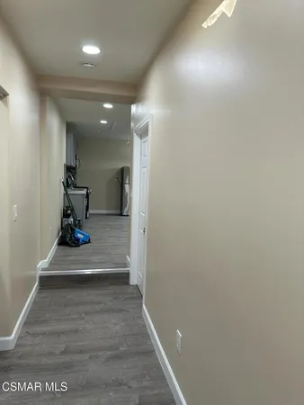 a bathroom with a sink a toilet a mirror and shower