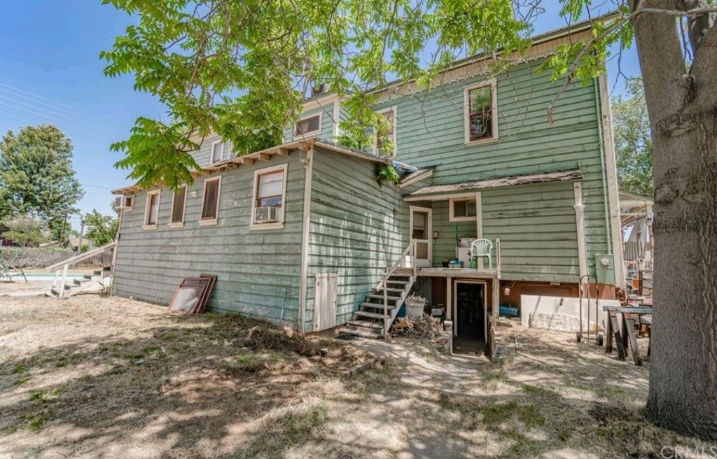 3121 Mulberry Street Riverside, CA 92501 - Photo 17 of 67 a view of a house with a yard and tree