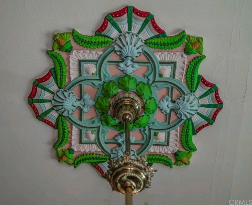 3121 Mulberry Street Riverside, CA 92501 - Photo 39 of 67 a vase of flowers sitting on a table with a chandelier