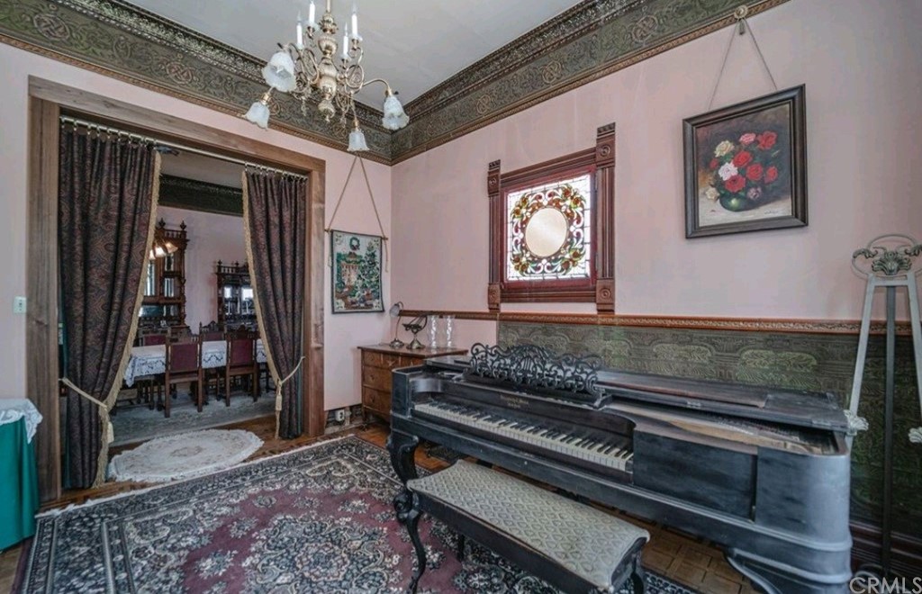 3121 Mulberry Street Riverside, CA 92501 - Photo 51 of 67 a living room with furniture piano and a rug