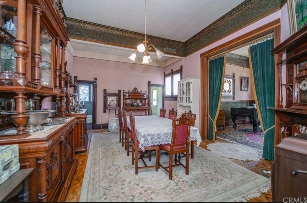 3121 Mulberry Street Riverside, CA 92501 - Photo 59 of 67 a dining room with furniture a rug and wooden floor