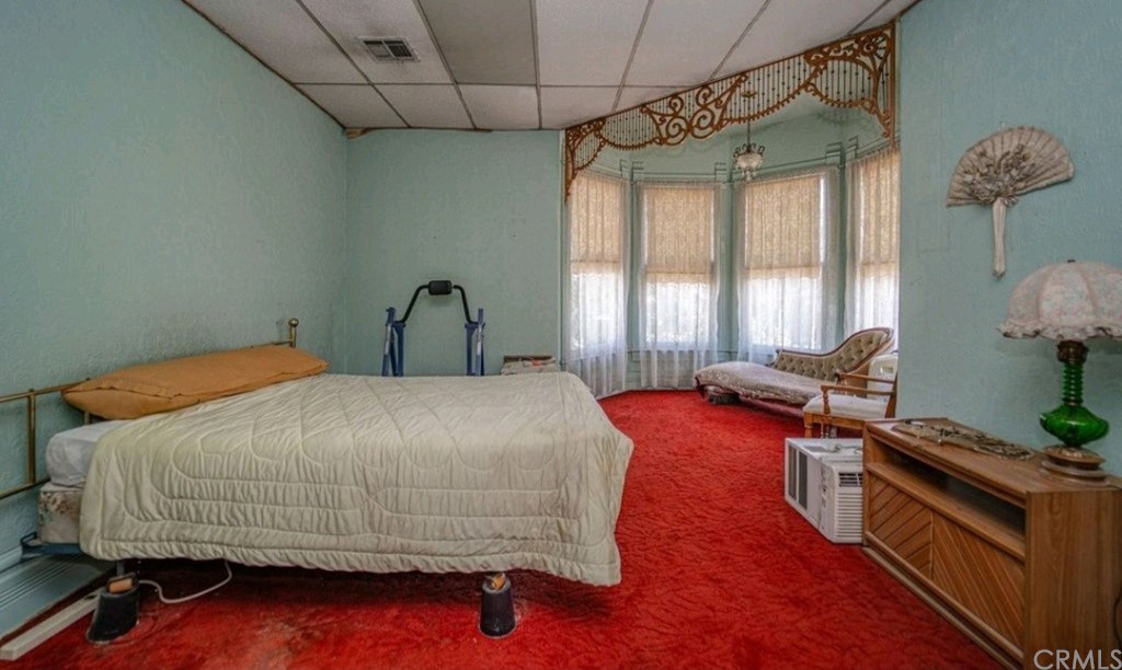 3121 Mulberry Street Riverside, CA 92501 - Photo 64 of 67 a bedroom with a bed and a potted plant on the dresser