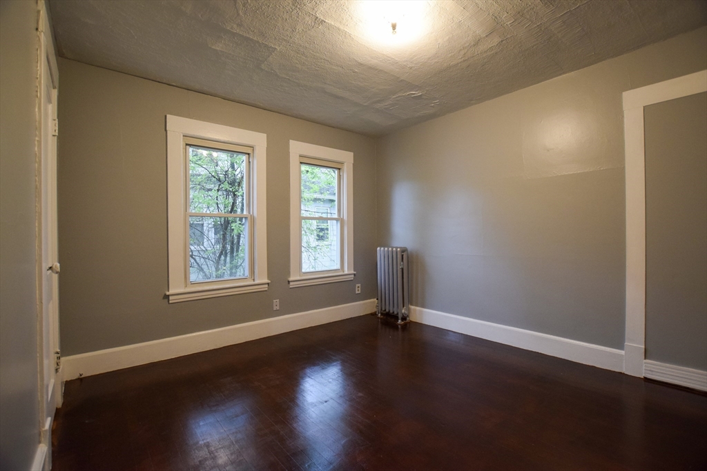 44 Gordon Street Springfield, MA 01108 - Photo 18 of 20 a view of a room with wooden floor and a window