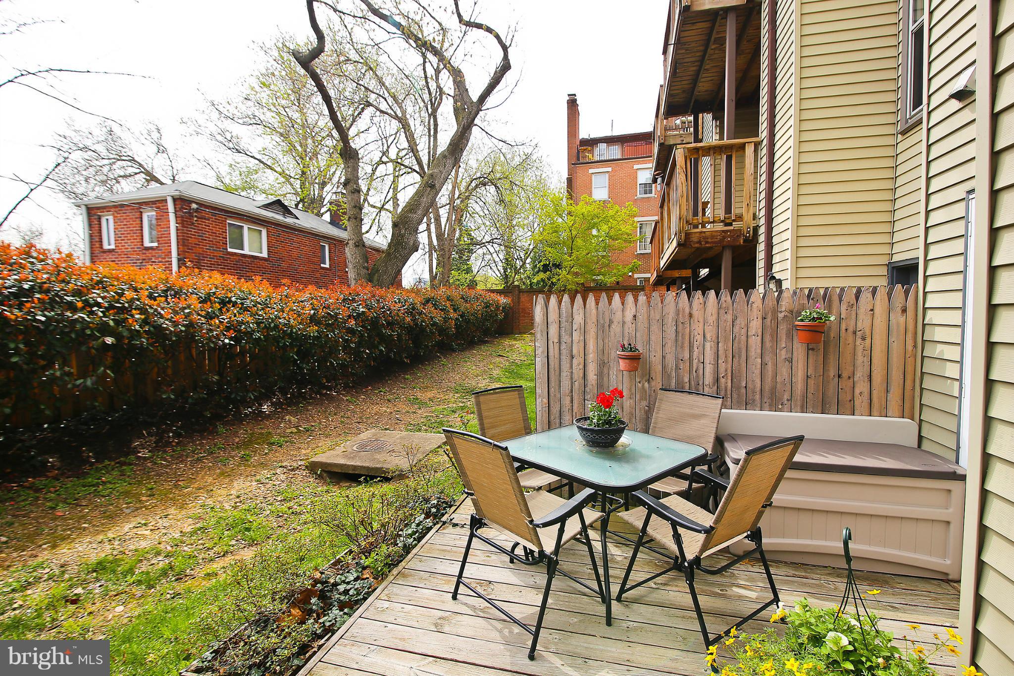 2103 North Rolfe Street, Unit A Arlington, VA 22209 - Photo 14 of 28 a view of a chairs and table in the patio