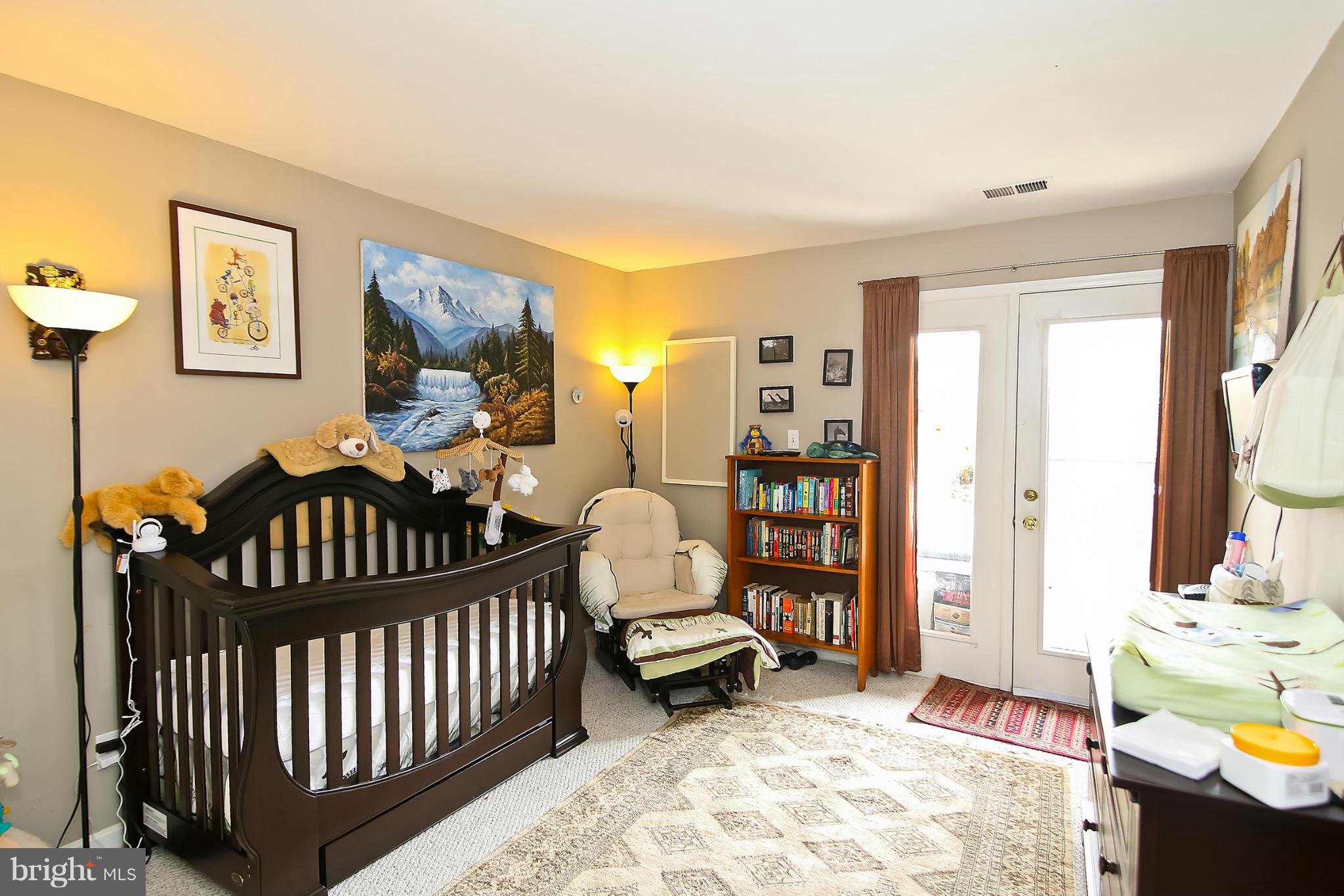 2103 North Rolfe Street, Unit A Arlington, VA 22209 - Photo 19 of 28 a bedroom with furniture and a window