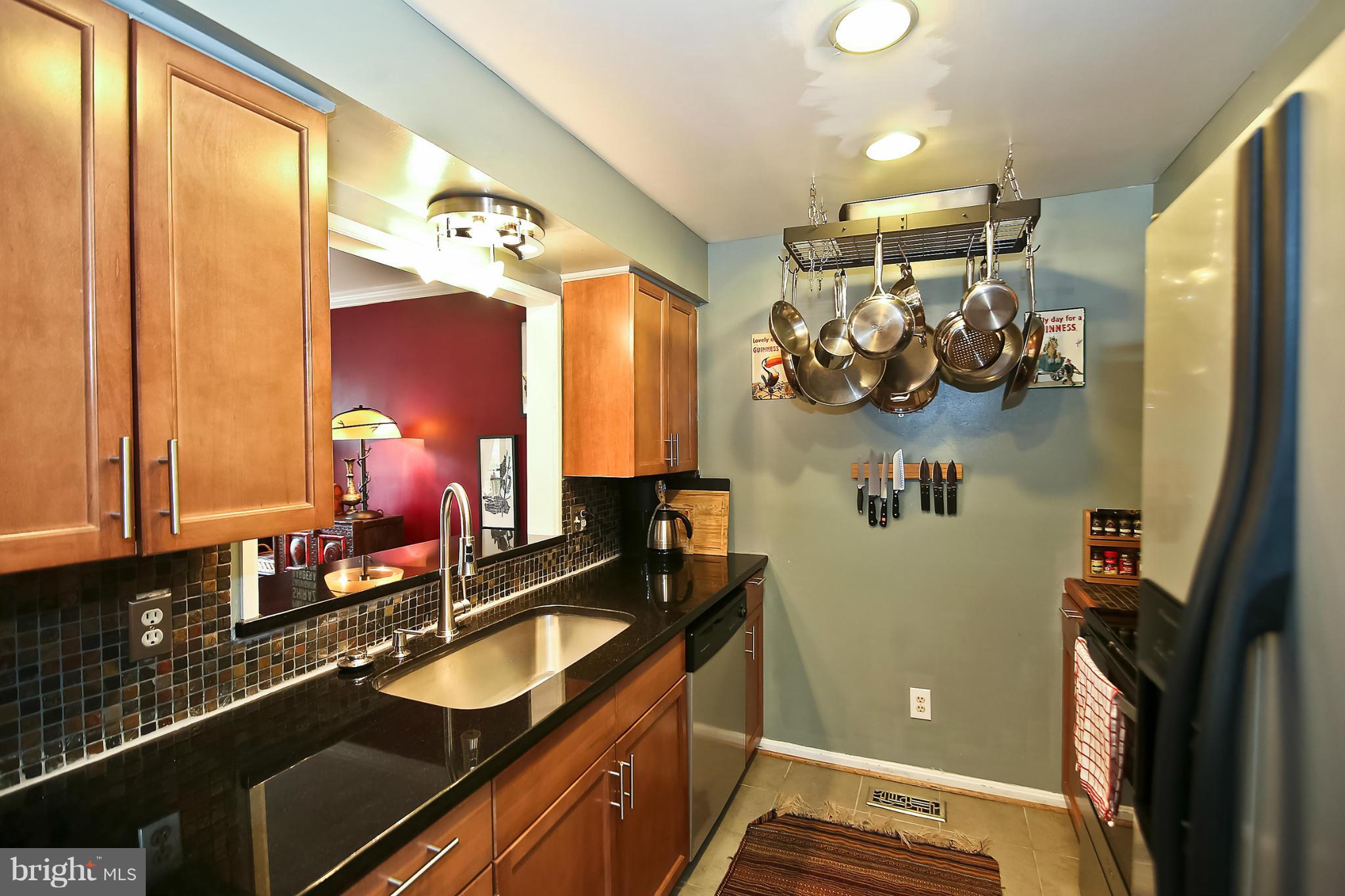 2103 North Rolfe Street, Unit A Arlington, VA 22209 - Photo 21 of 28 a bathroom with a sink and a mirror