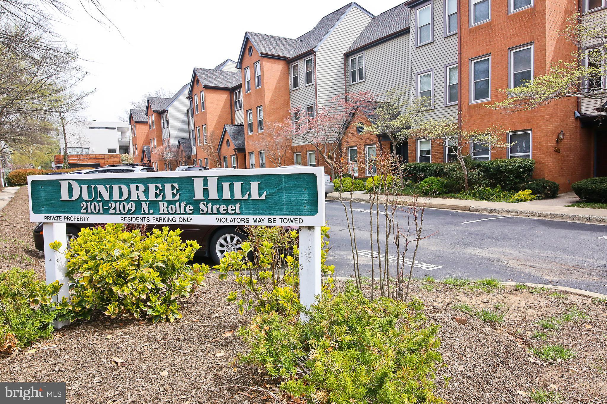 2103 North Rolfe Street, Unit A Arlington, VA 22209 - Photo 23 of 28 a sign on the side of a building