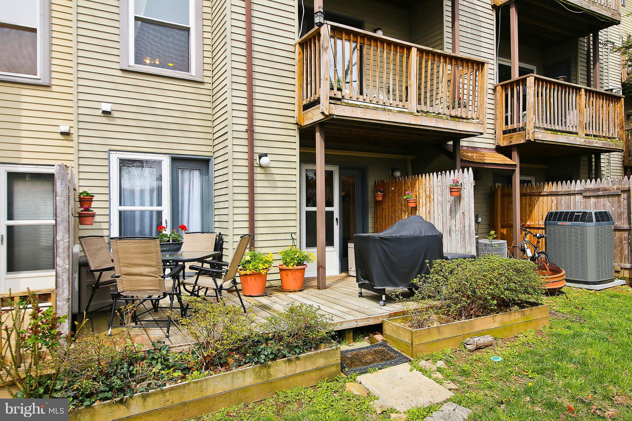 2103 North Rolfe Street, Unit A Arlington, VA 22209 - Photo 24 of 28 a view of a house with backyard porch and sitting area