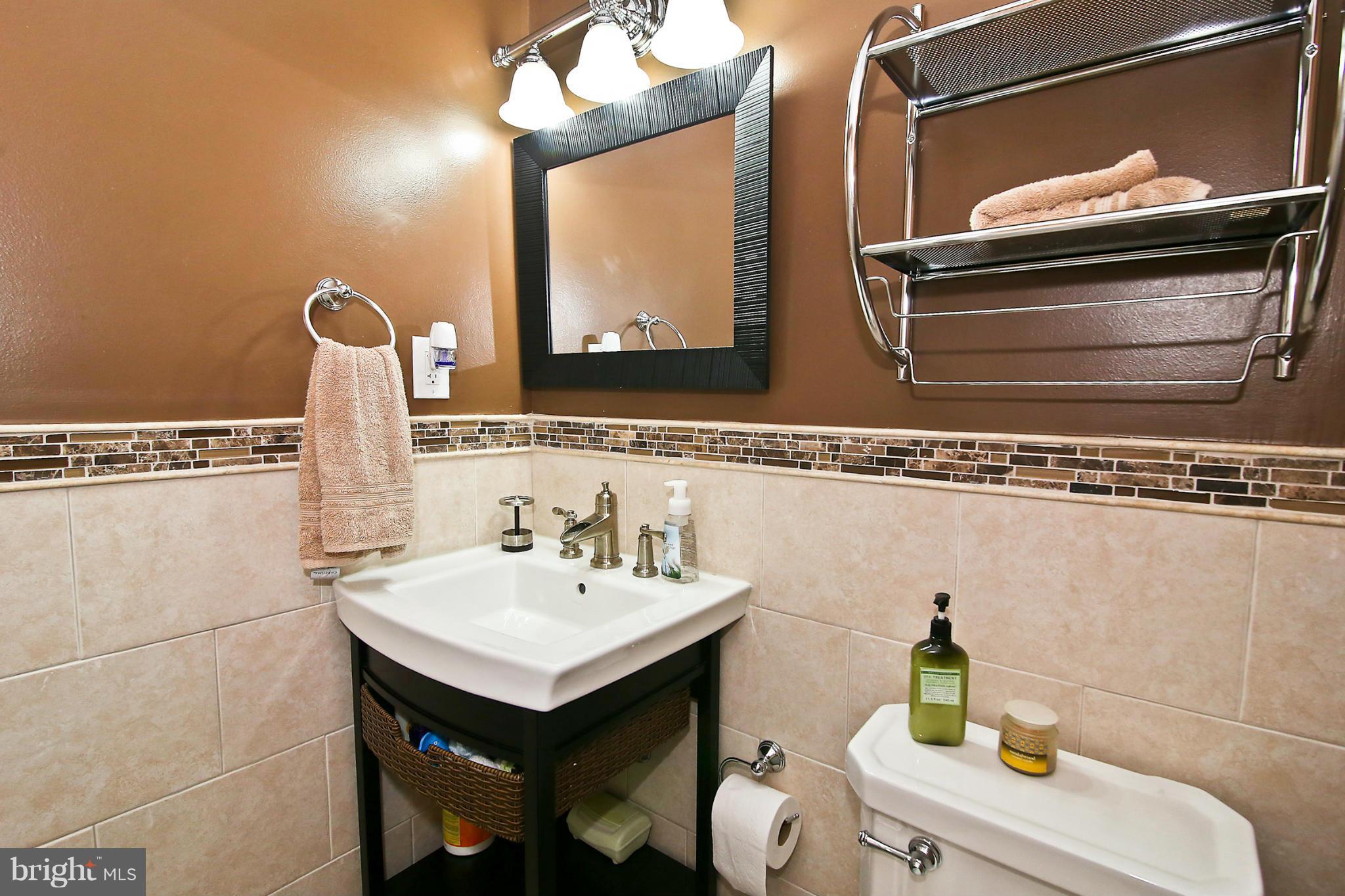 2103 North Rolfe Street, Unit A Arlington, VA 22209 - Photo 25 of 28 a bathroom with a sink and a mirror