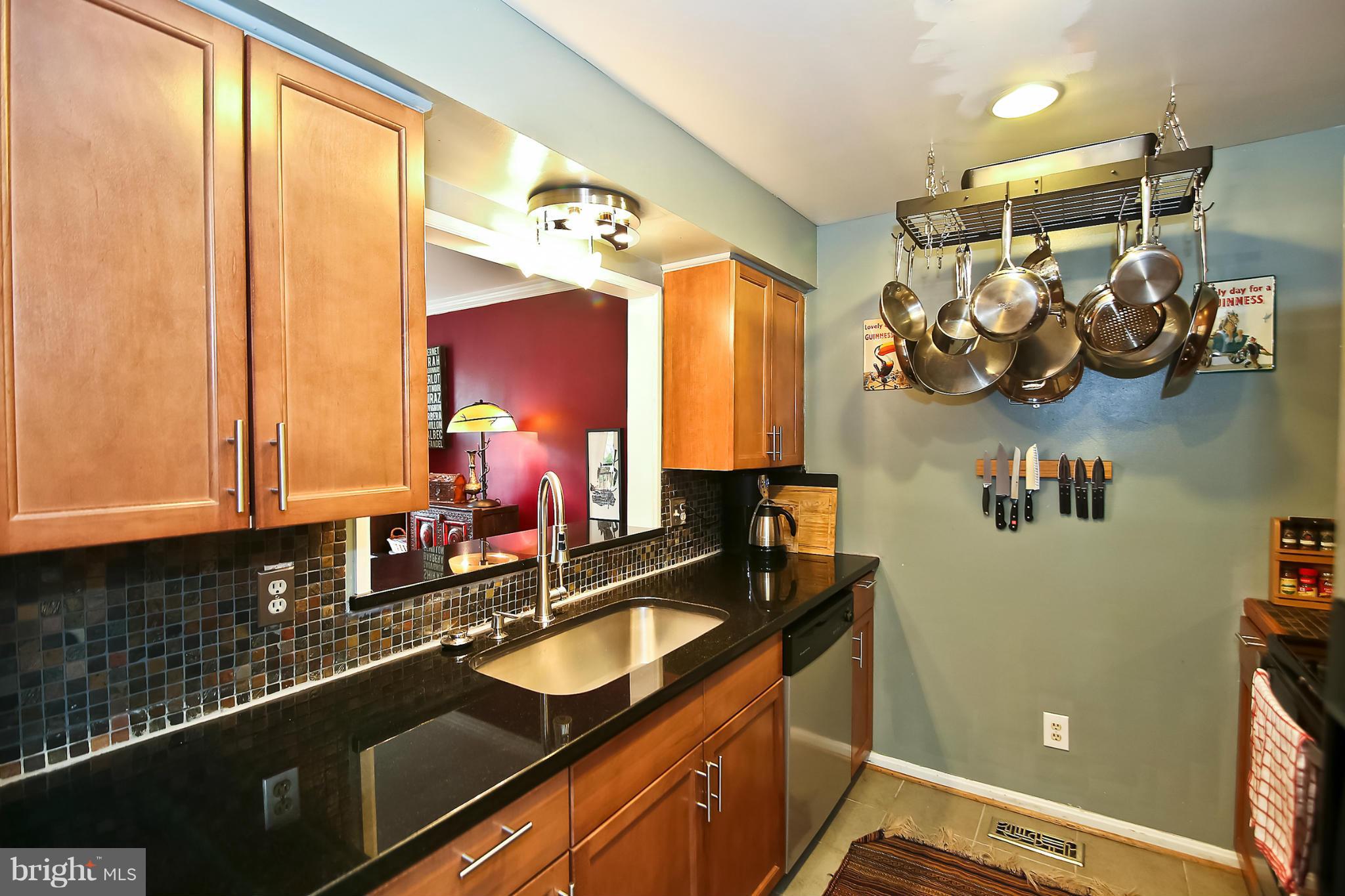2103 North Rolfe Street, Unit A Arlington, VA 22209 - Photo 6 of 28 a view of a kitchen with a sink and cabinets
