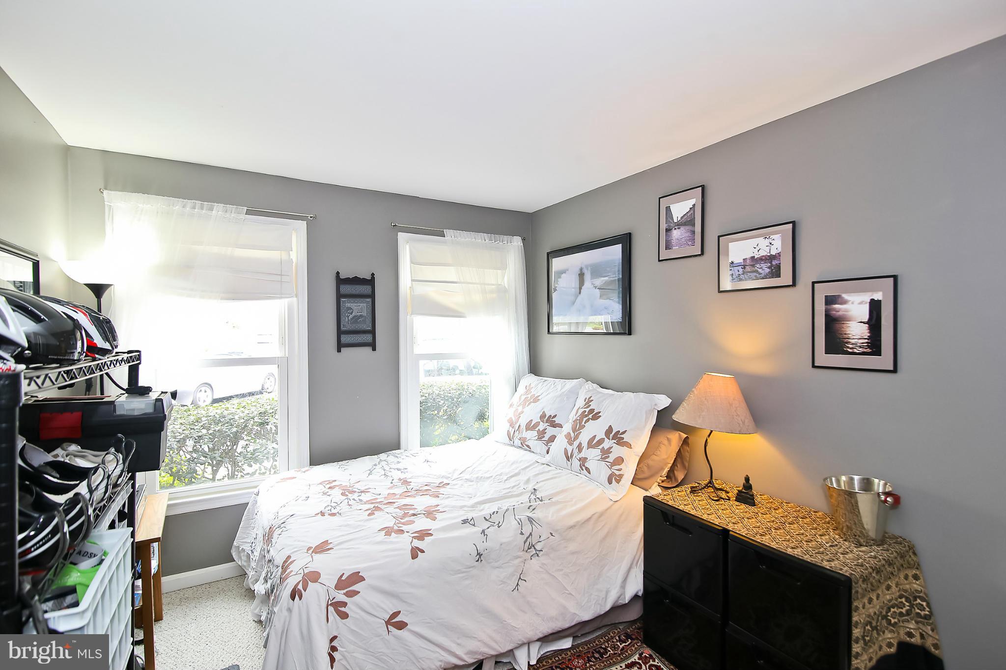 2103 North Rolfe Street, Unit A Arlington, VA 22209 - Photo 7 of 28 a bedroom with a bed and a window