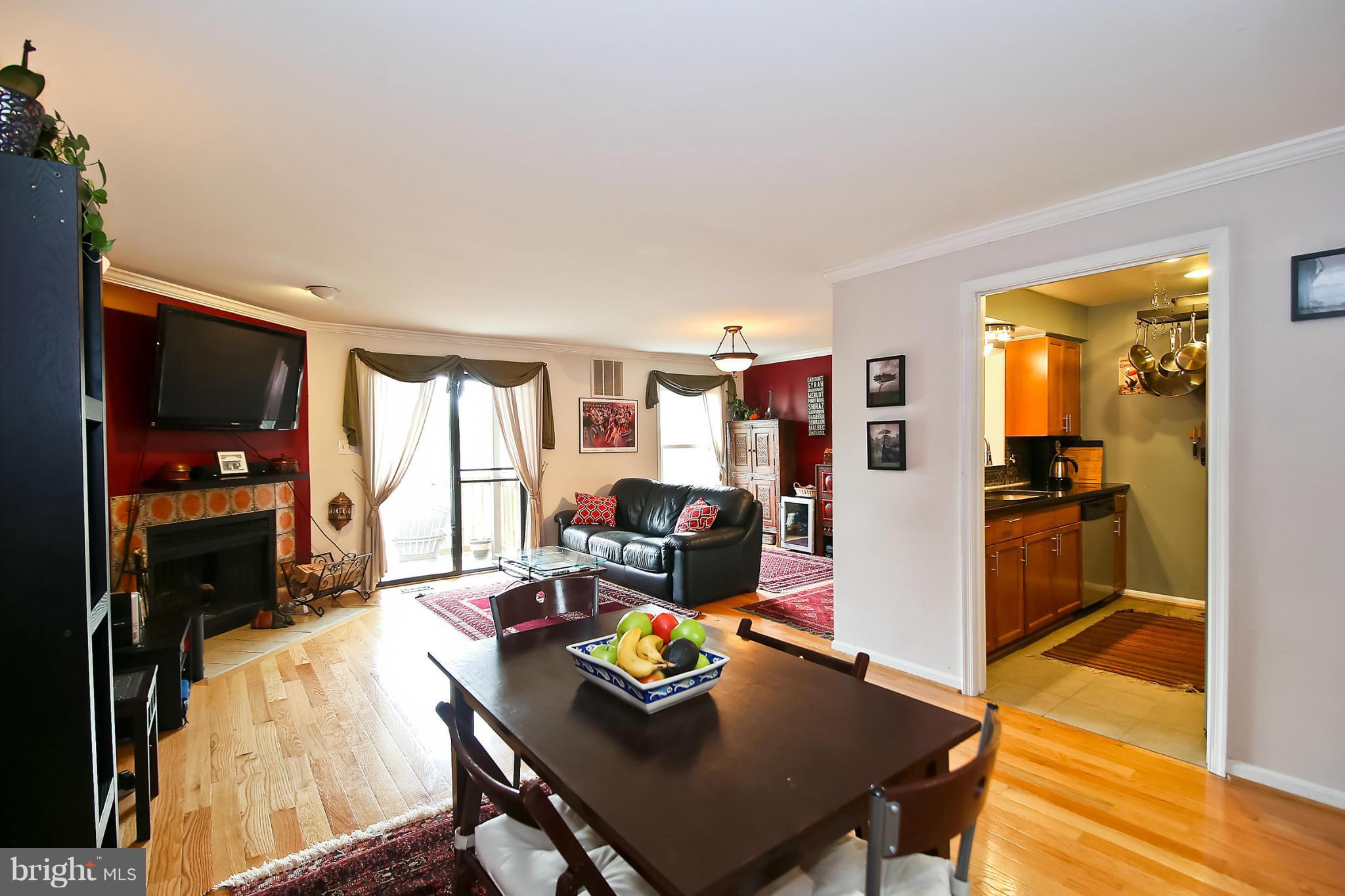 2103 North Rolfe Street, Unit A Arlington, VA 22209 - Photo 9 of 28 a living room with furniture and a window