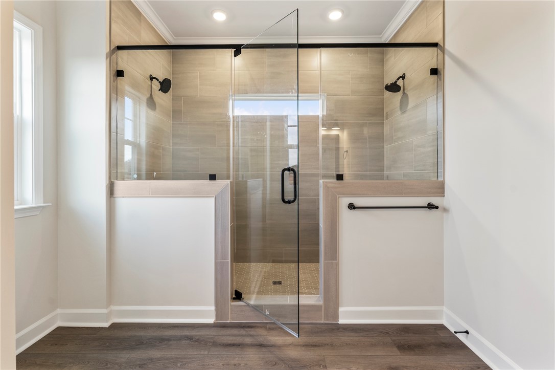 3140 Midway Road Anderson, SC 29621 - Photo 22 of 39 This modern bathroom features a spacious shower with sleek glass enclosure and contemporary fixtures.