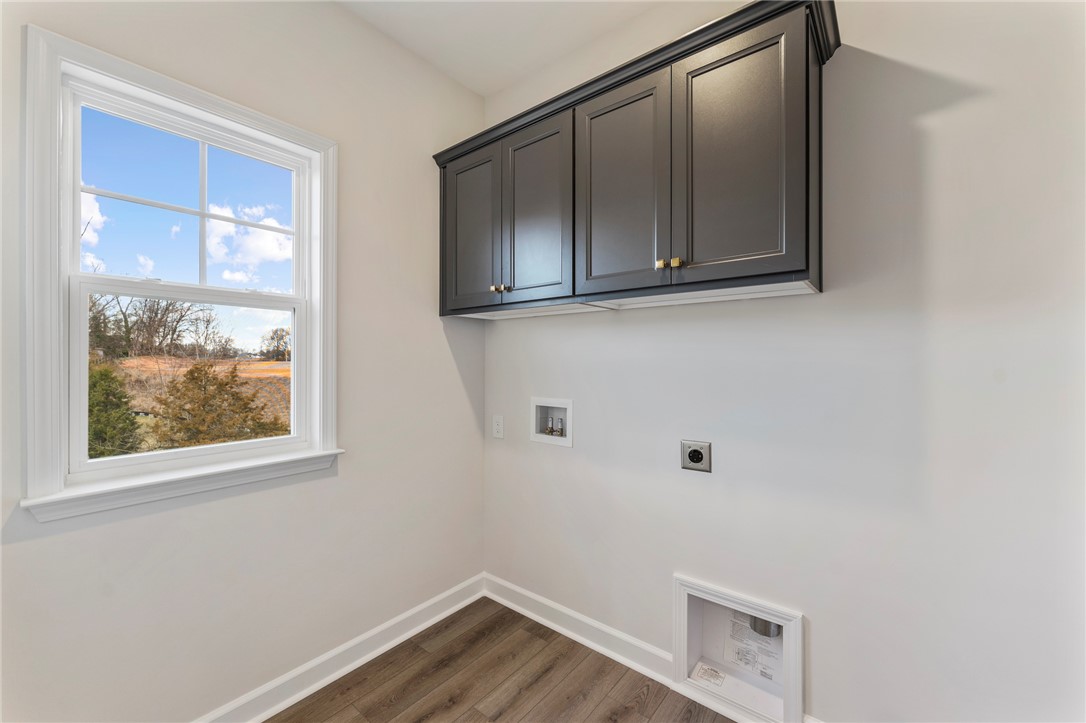 3140 Midway Road Anderson, SC 29621 - Photo 23 of 39 This bright laundry space features convenient storage and durable flooring.