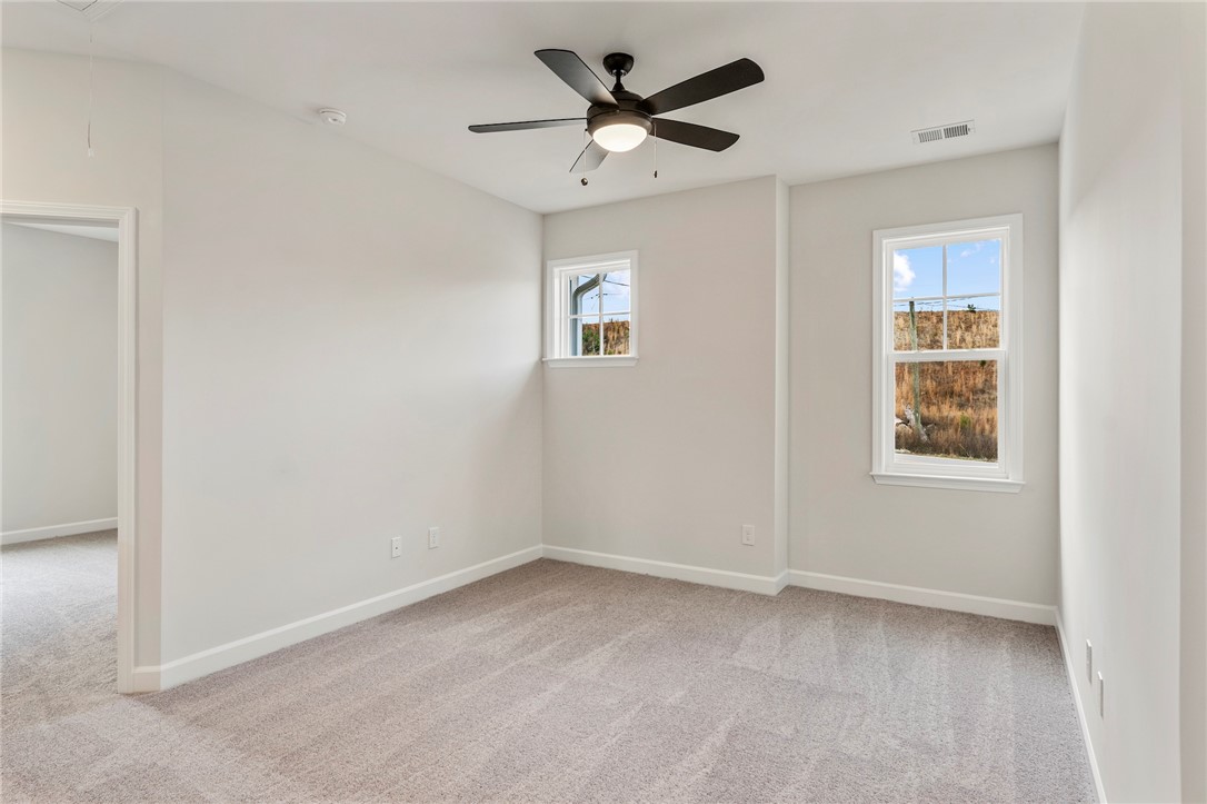 3140 Midway Road Anderson, SC 29621 - Photo 24 of 39 This airy bedroom offers plush carpeting and ample natural light, ideal for peaceful living.