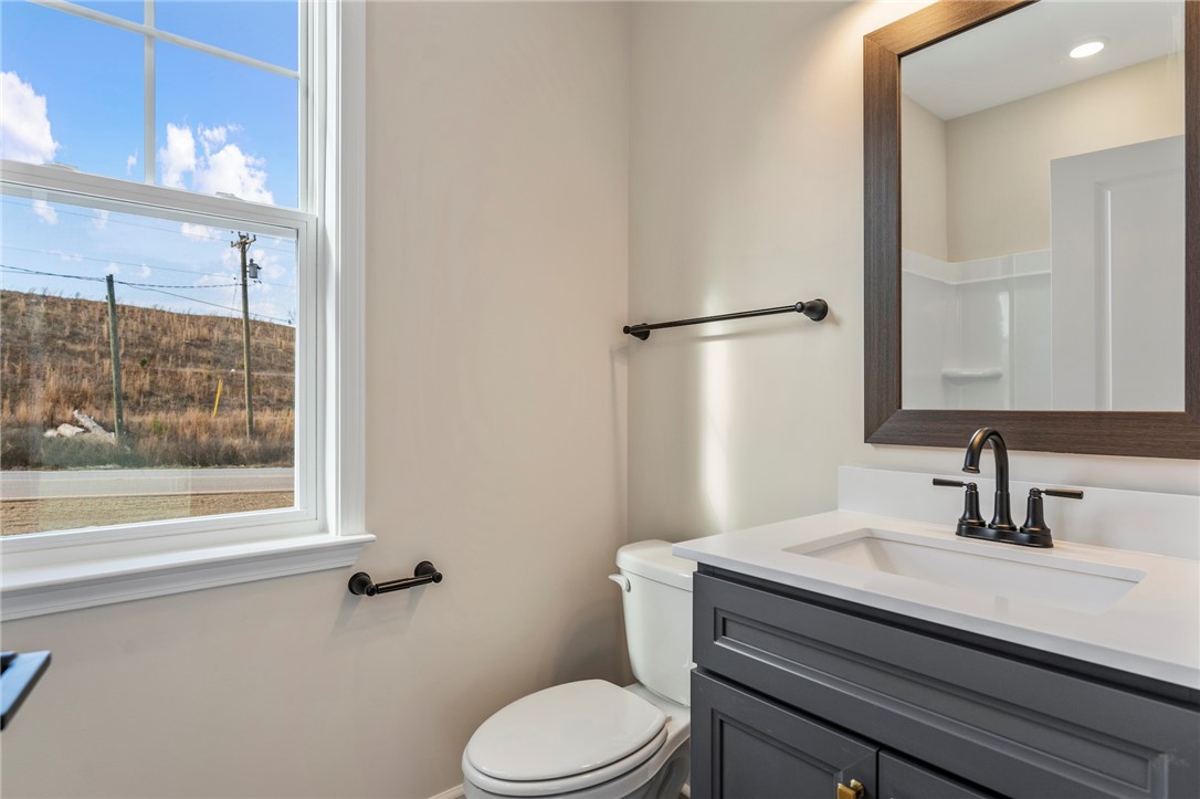 3140 Midway Road Anderson, SC 29621 - Photo 32 of 39 This bright bathroom features a modern vanity and an inviting window view.