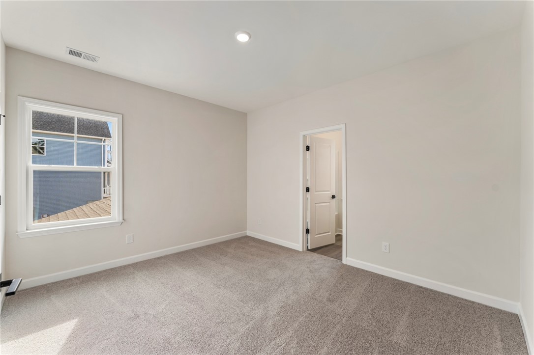 3140 Midway Road Anderson, SC 29621 - Photo 33 of 39 This inviting bedroom features soft carpet flooring and abundant natural light.