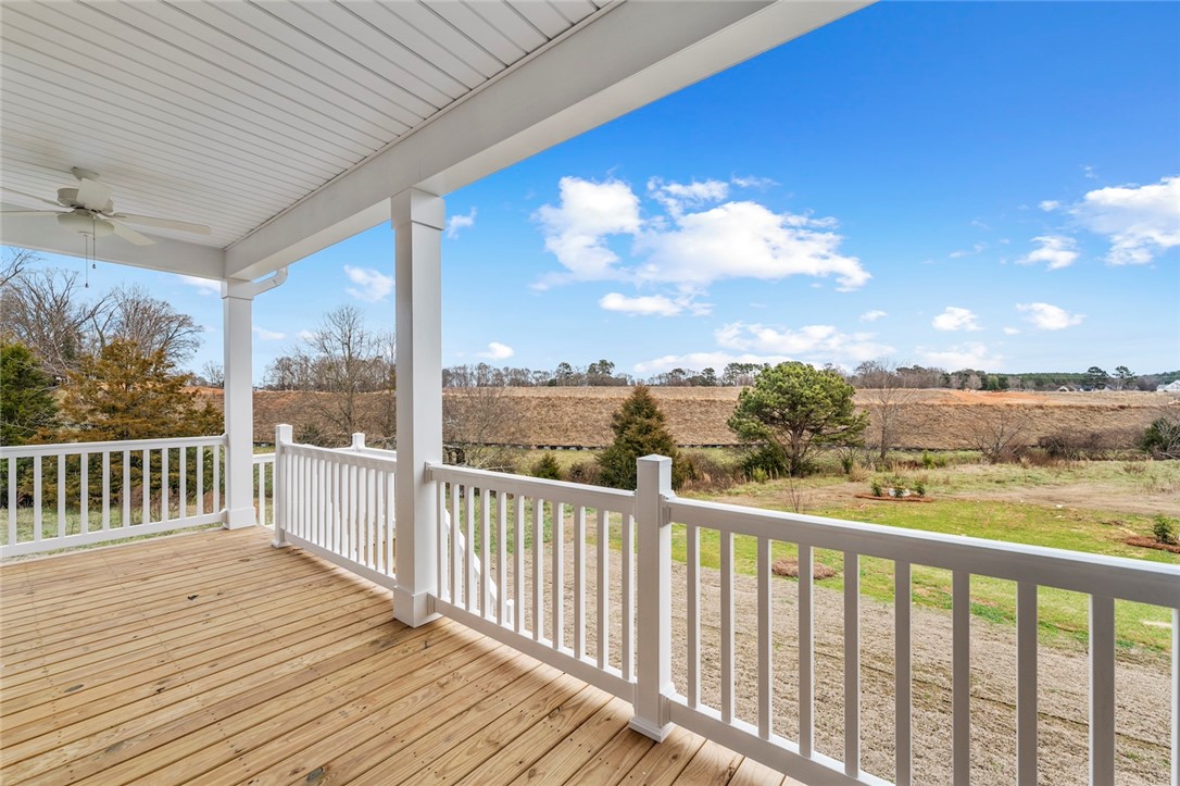 3140 Midway Road Anderson, SC 29621 - Photo 35 of 39 This inviting porch offers serene outdoor living and expansive views of the natural landscape.